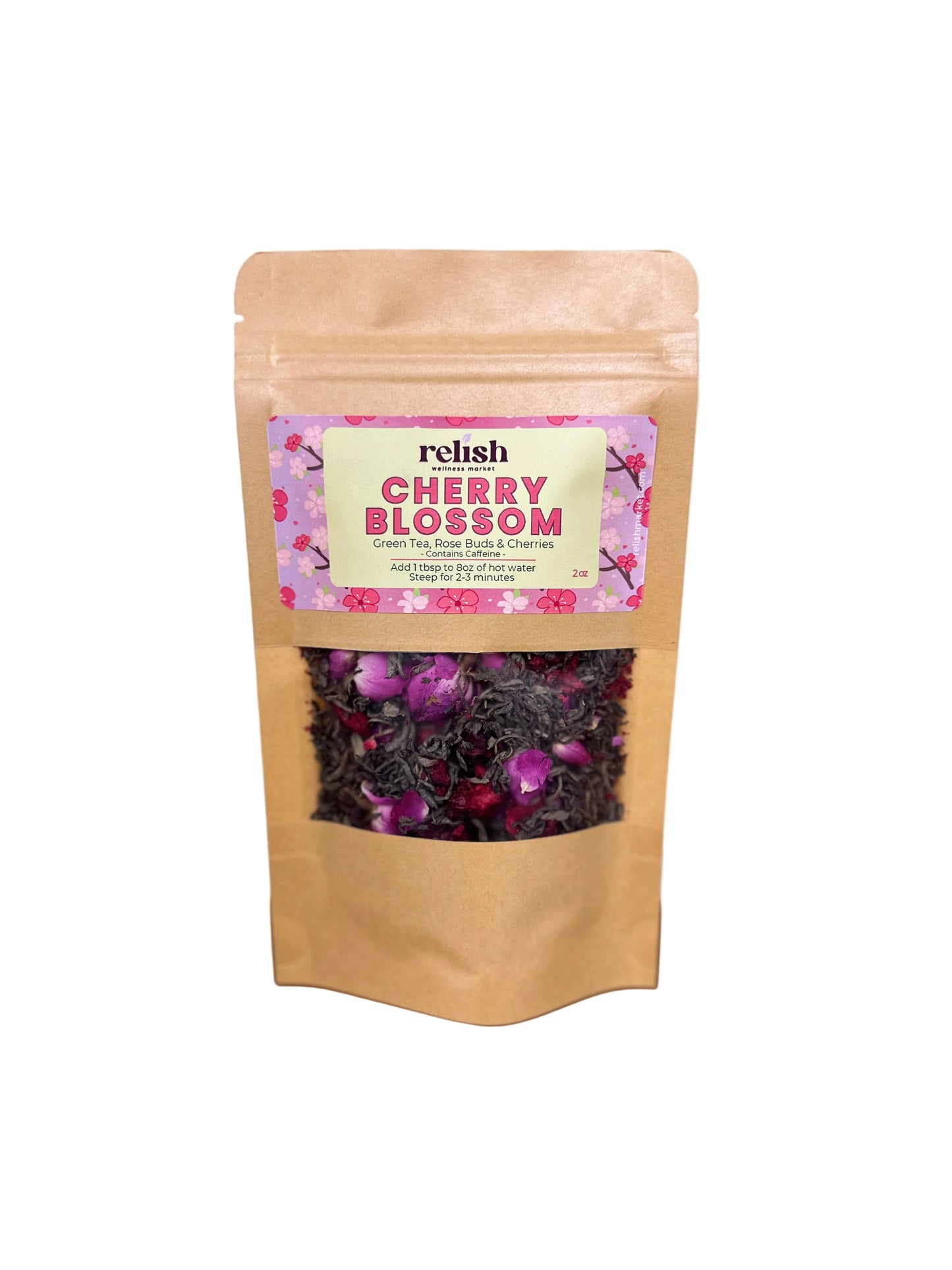 Kraft paper packaging of cherry blossom tea blend by Relish Market with a pink label on a wooden surface.