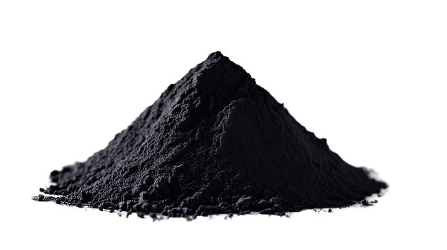 A mound of activated charcoal powder on a white background.