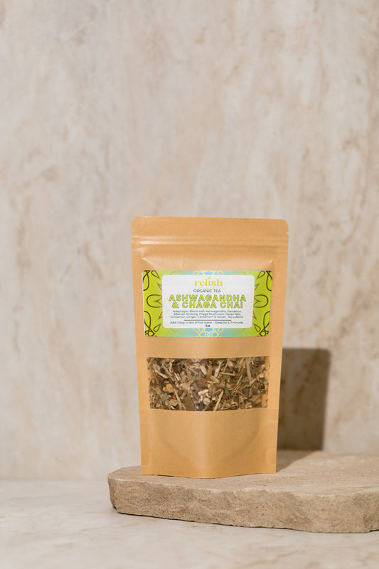 Ashwagandha & Chaga Chai Tea Blend on a stone slab and neutral background.