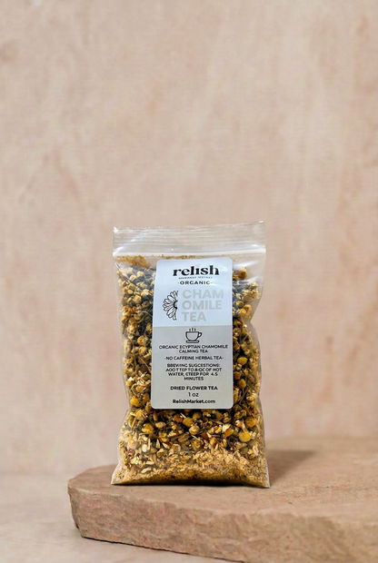 Chamomile flower tea by Relish Market on a stone slab and a neutral background.
