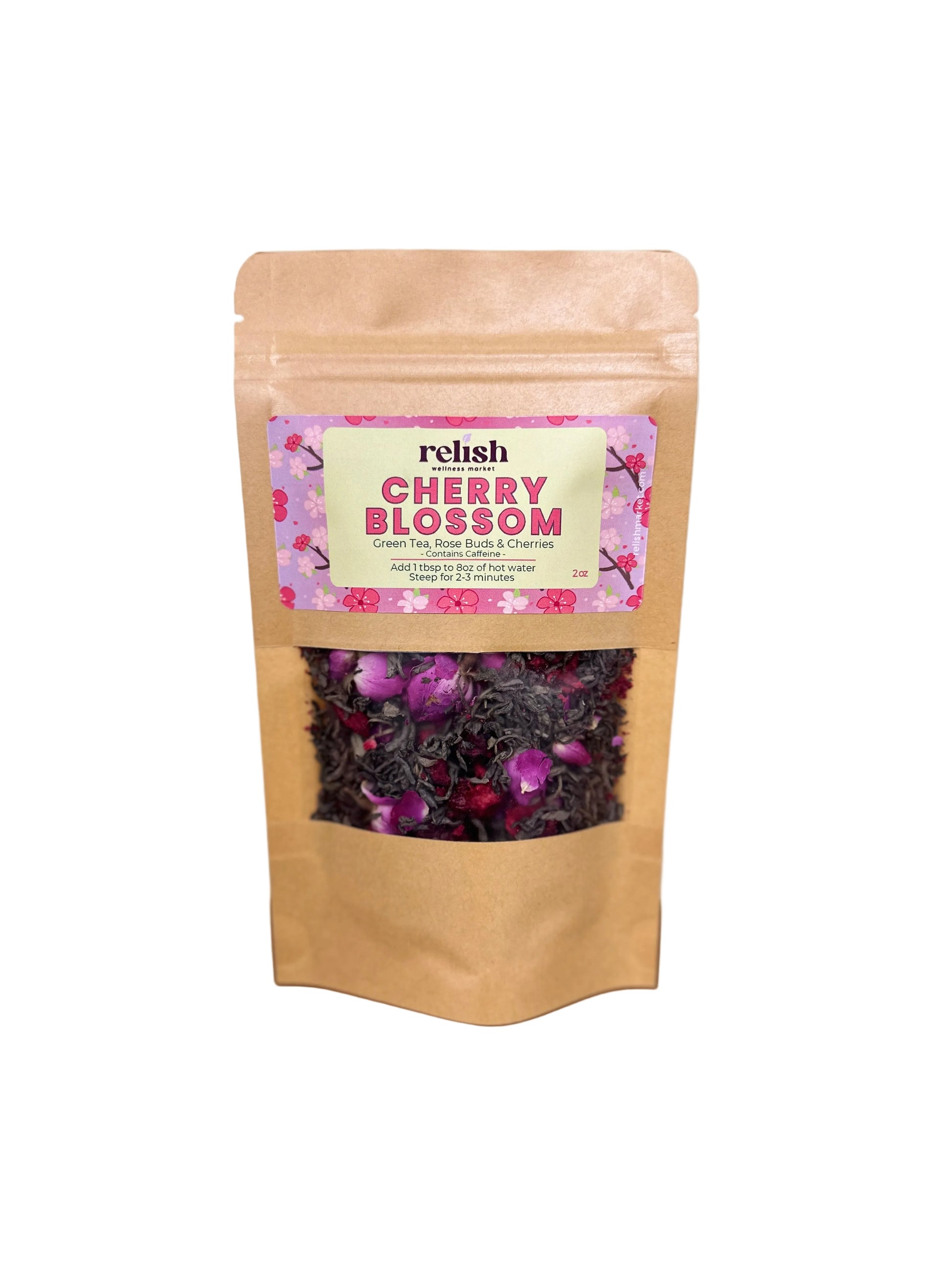 Kraft paper packaging of cherry blossom tea blend by Relish Market with a pink label on a wooden surface.