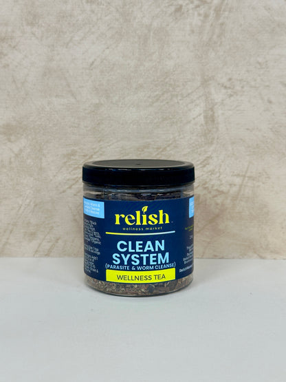 Jar of relish Clean System Wellness Tea on a neutral background
