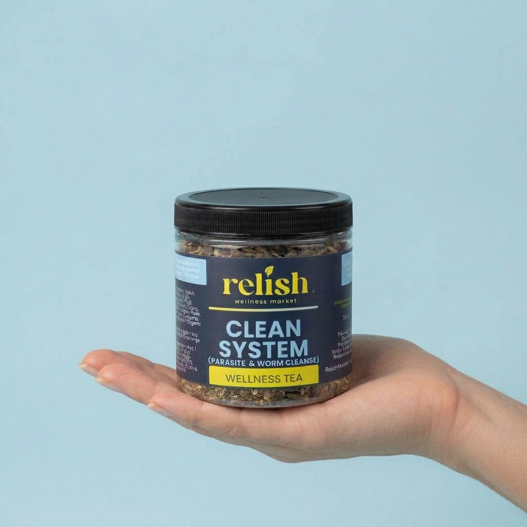A hand holding a clear jar of Relish Wellness Clean System Wellness Tea against a solid light blue background.
