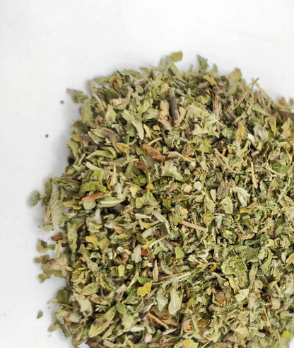 A mound of loose Damiana Leaf on a white background