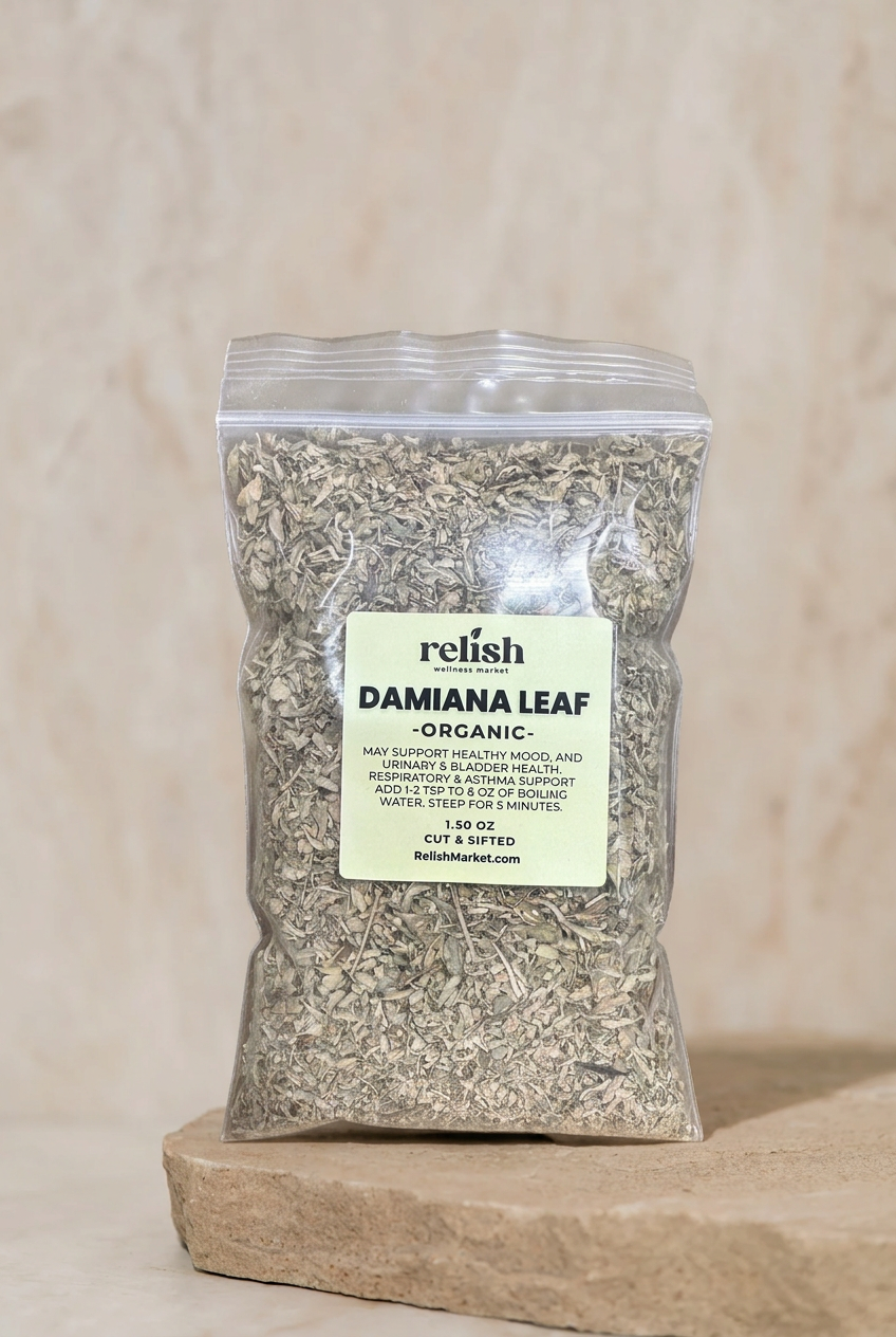 Clear zip bag of Organic Damiana Leaf by Relish Market on a stone slab and neutral textured background