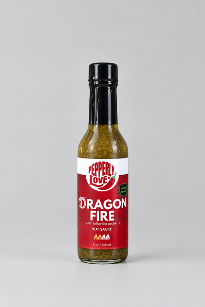 A bottle of Peppery Love Dragon Fire hot sauce on a light grey background.