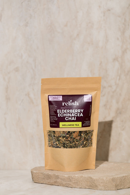 Elderberry Echinacea Chai Tea by Relish Market on a stone slab with a neutral background. Wellness tea for immunity boost cold flu.