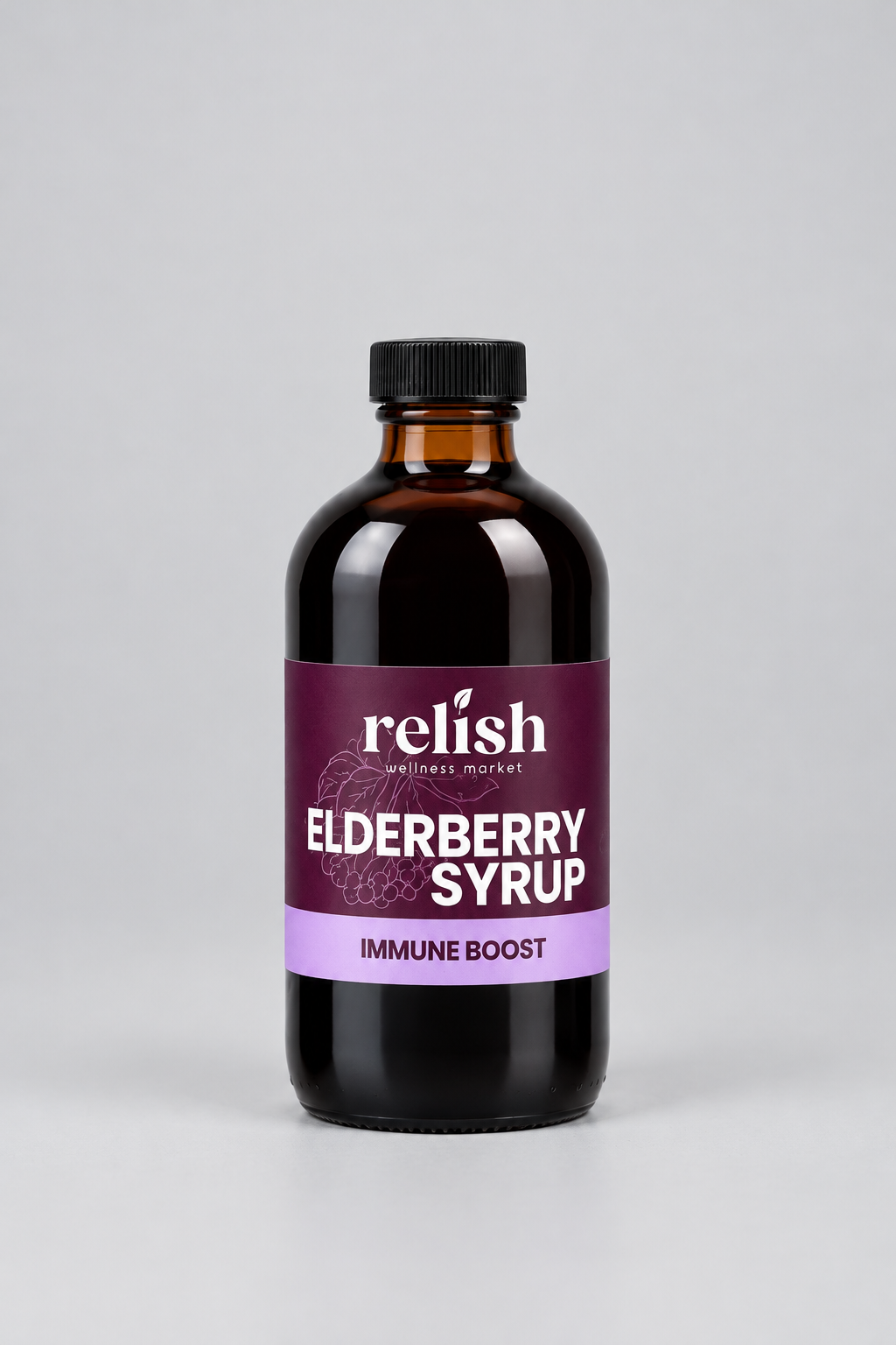 A bottle of Relish Market Elderberry Syrup with an amber glass body, black cap, and a purple label, centered on a light gray background.