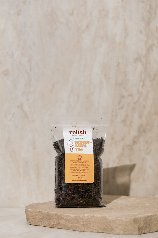 Packaged Honeybush Tea by Relish Market on a stone surface with a neutral background