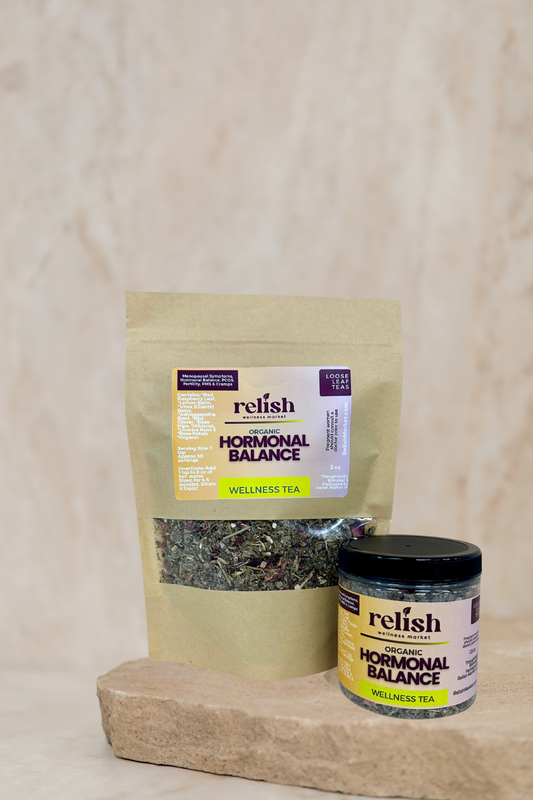 Relish Hormonal Balance wellness tea packaging on a stone surface