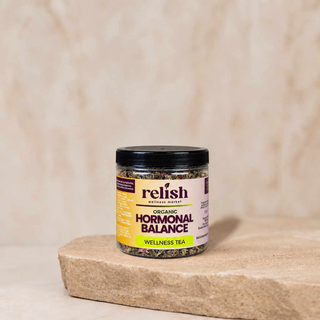 Jar of Relish Market Hormonal Balance Wellness Tea on a stone surface with a textured beige background