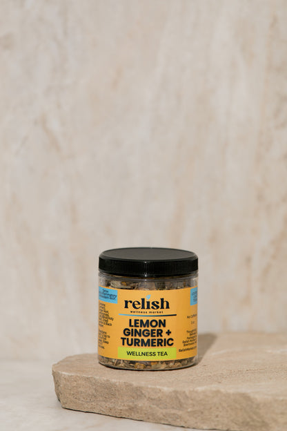 Lemon Ginger Turmeric Tea jar on a stone slab and neutral background.