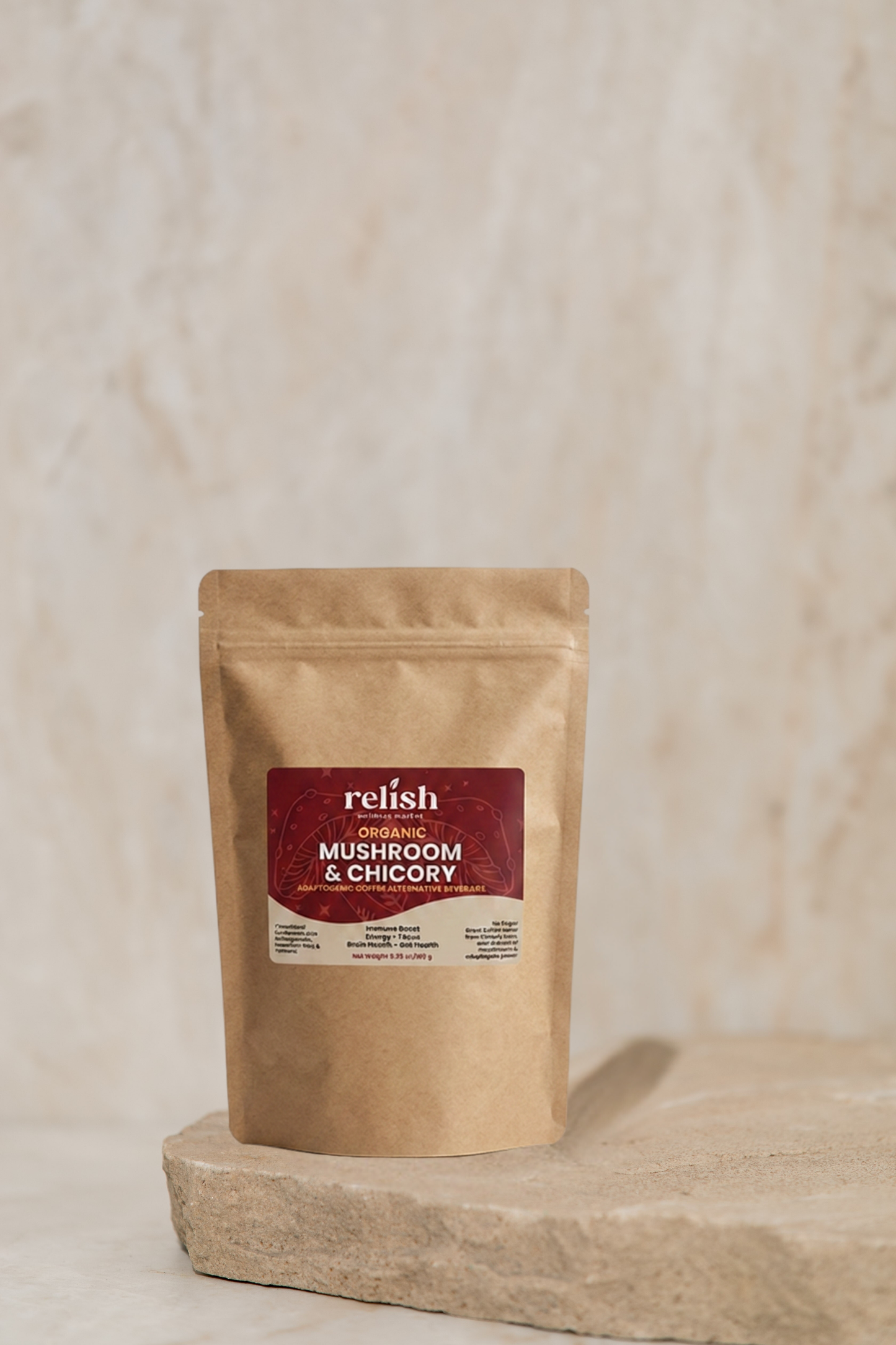 A stand-up pouch of Relish Organic Mushroom & Chicory coffee blend, displayed on a textured stone slab against a neutral beige background.