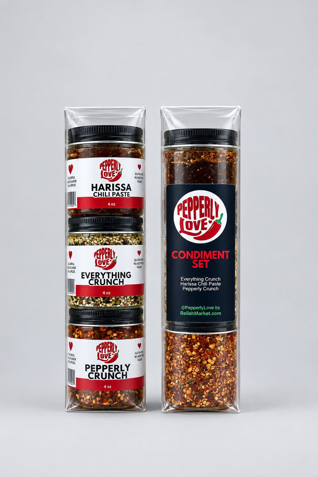 A Pepperly Love condiment set containing three condiment jars to include Harissa Chili Paste, Pepperly Crunch and Everything Crunch, packaged in clear plastic sleeves on a white background.