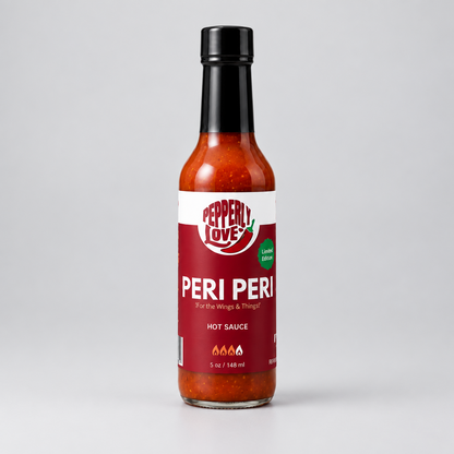 A 5 oz glass bottle of Pepperly Love Peri Peri Hot Sauce, featuring a red and white label with a black cap, set against a neutral light gray background.