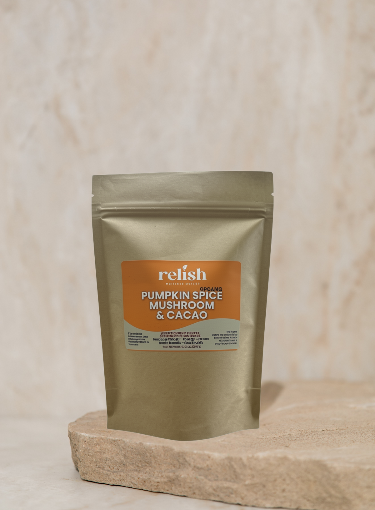 A stand-up pouch of Relish Market Organic Pumpkin Spice Mushroom and Cacao, displayed on a textured stone slab against a neutral beige marble background.