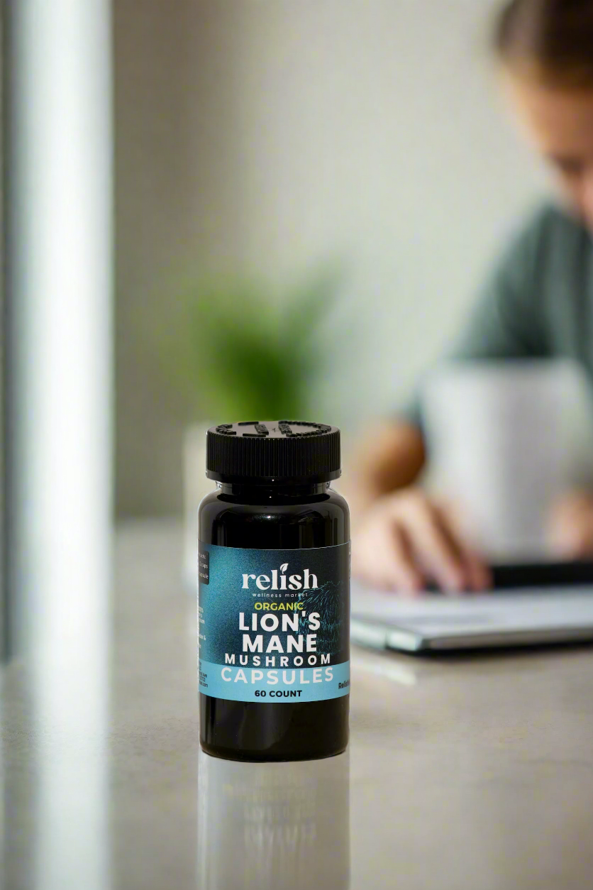 Relish Market Lions Mane Capsules with person in background laptop