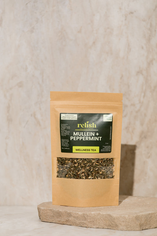 Kraft zip bag of Relish Market mullein & peppermint tea on a stone slab and neutral background