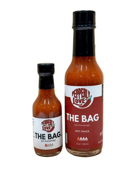 Pepperly Love Small and Large The Bag Hot Sauce bottles on a white background