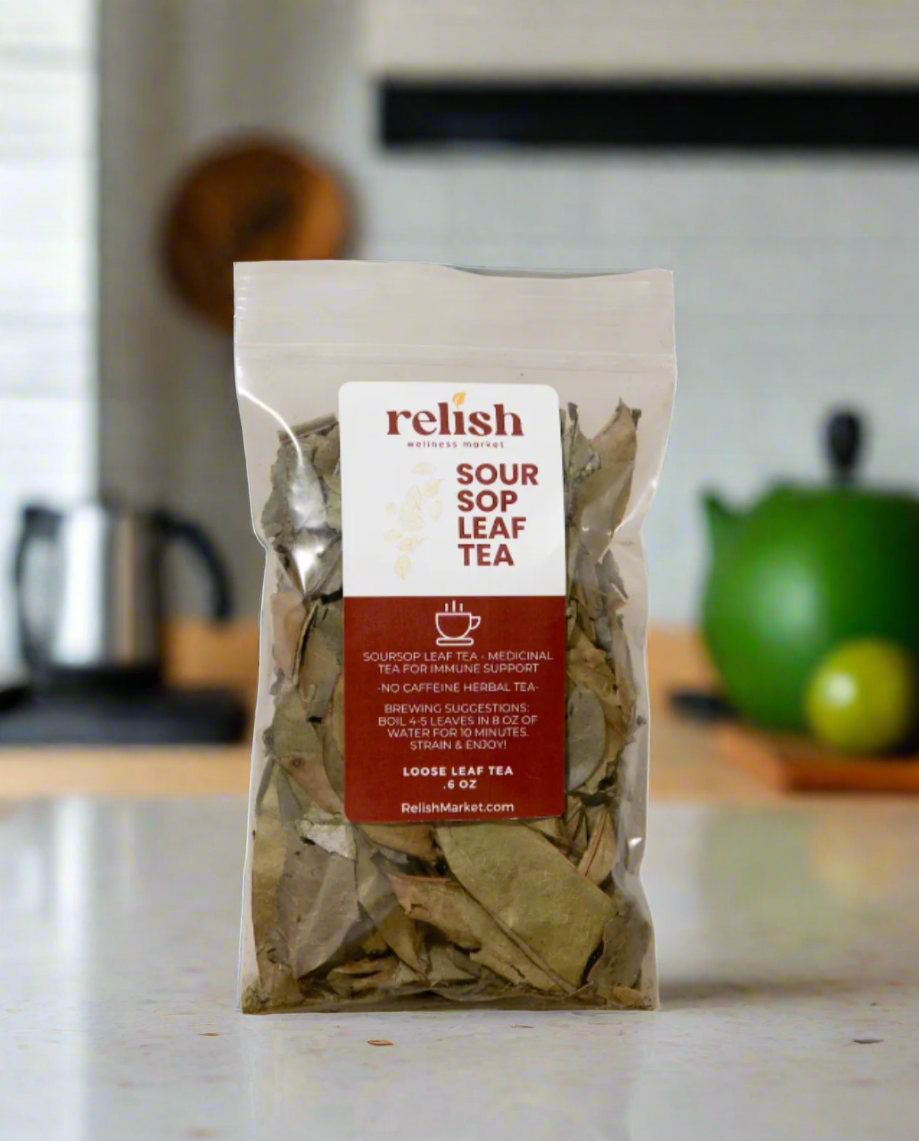 A clear stand-up pouch of Relish Market Soursop Leaf Tea on a kitchen counter with a tea kettle in the background.