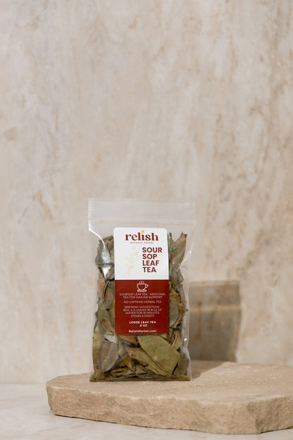 Packaged soursop leaf tea with Relish Market label on a stone surface
