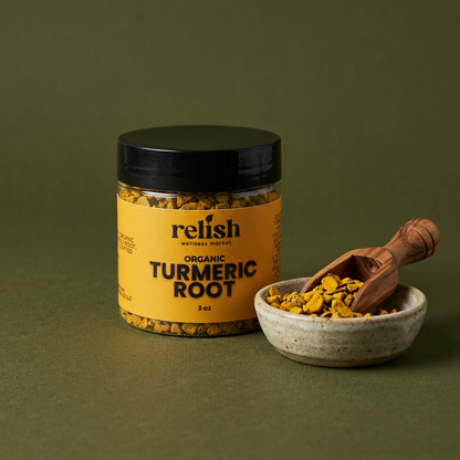 Turmeric Root jar and dried root pieces on an olive background