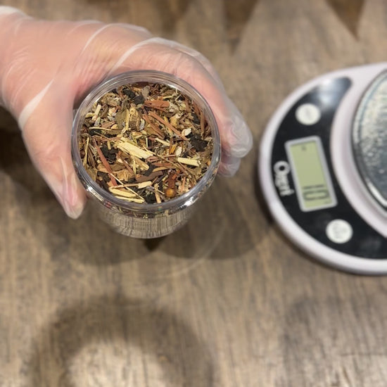 Video of hand holding jar of Clean System Detox loose leaf tea
