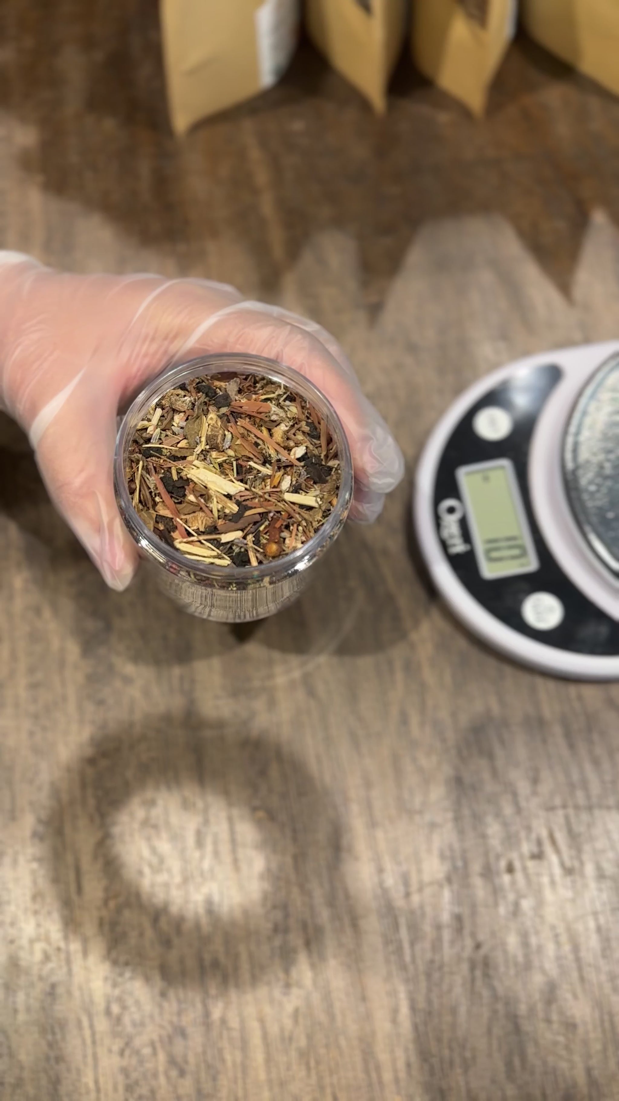 Video of hand holding jar of Clean System Detox loose leaf tea